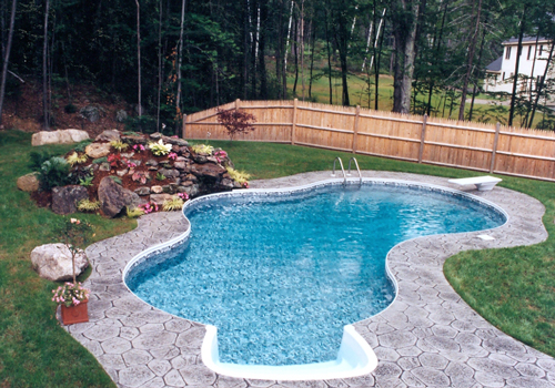 16' x 32' Tahiti with stamped decking by Blue Dolphin Pools & Spas