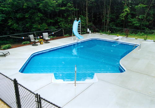 18' x 41' Bahama Lazy 'L' with broom finished decking by Blue Dolphin Pools & Spas