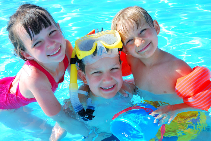 Kids playing with pool accessories