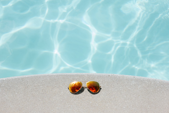 Sunglasses near a pool