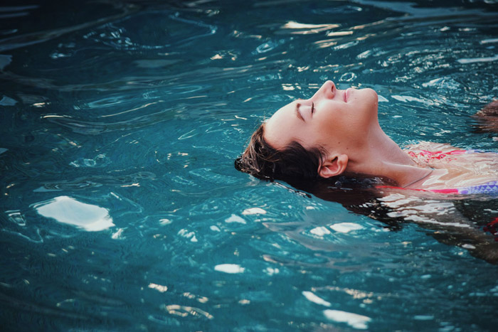 Woman relaxing in the pool